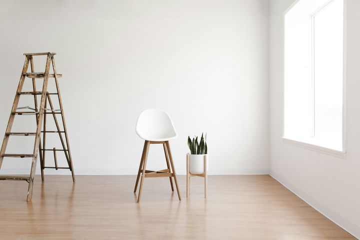 Light wood-look flooring with a ladder and a plant